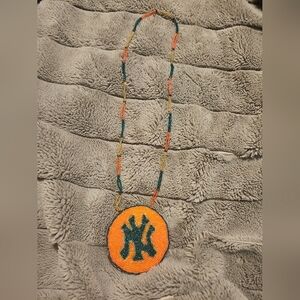 Handcrafted Beaded Necklace with Orange and Green Pendant
